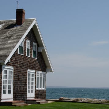Cedar shingle house on the water in Cape Cod.