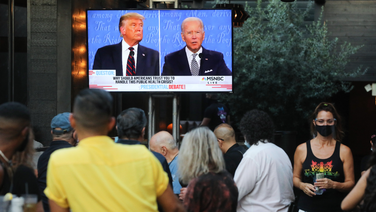 People sit and watch a broadcast of the first debate between President Donald Trump and Democratic presidential nominee Joe Biden.