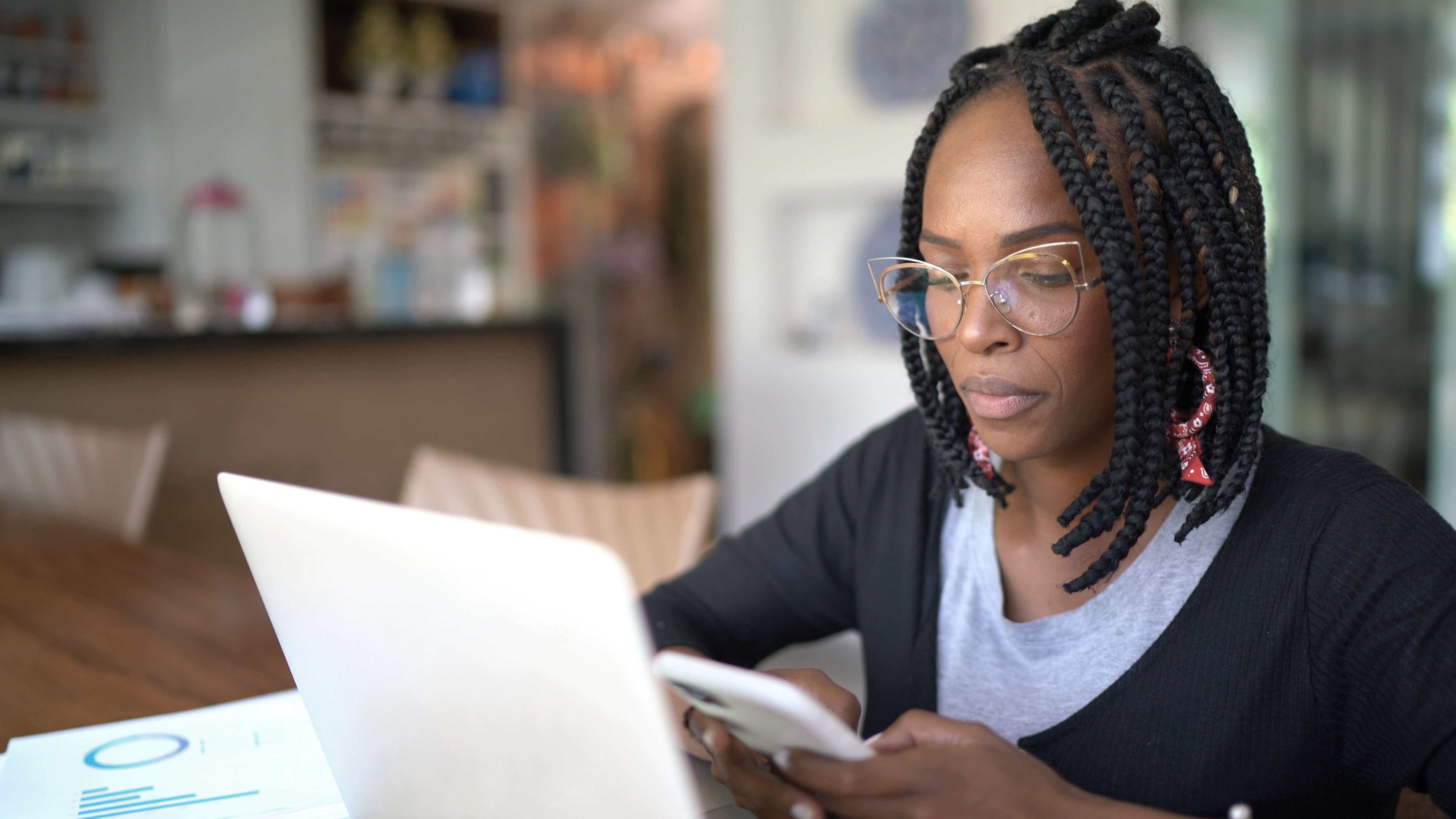 Female customer reviewing card application