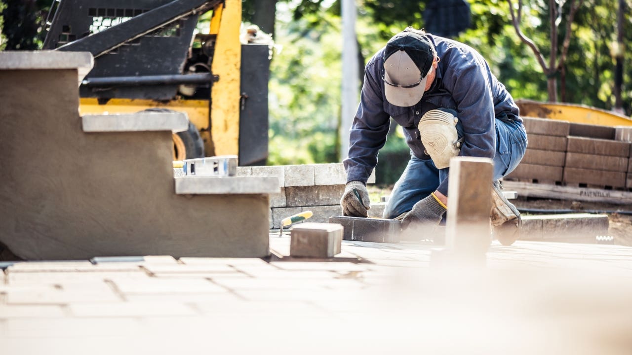 A homeowner makes improvements to an outdoor deck.