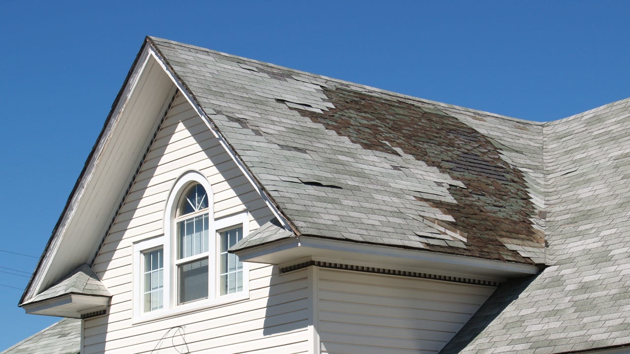 A close-up of a roof in desperate need of repair.