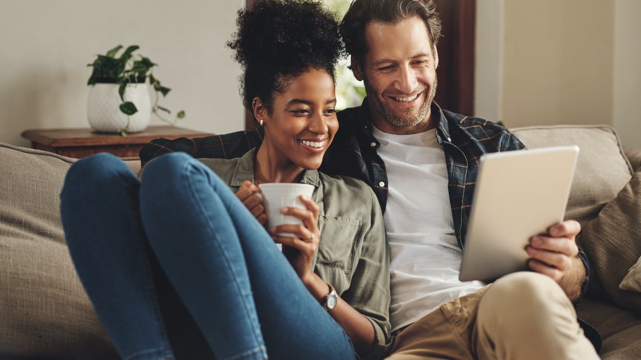 A couple explores their mortgage options online