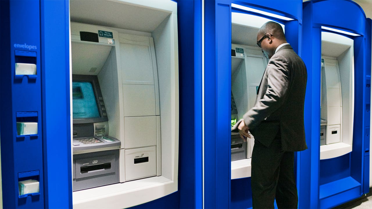 Man using ATM.