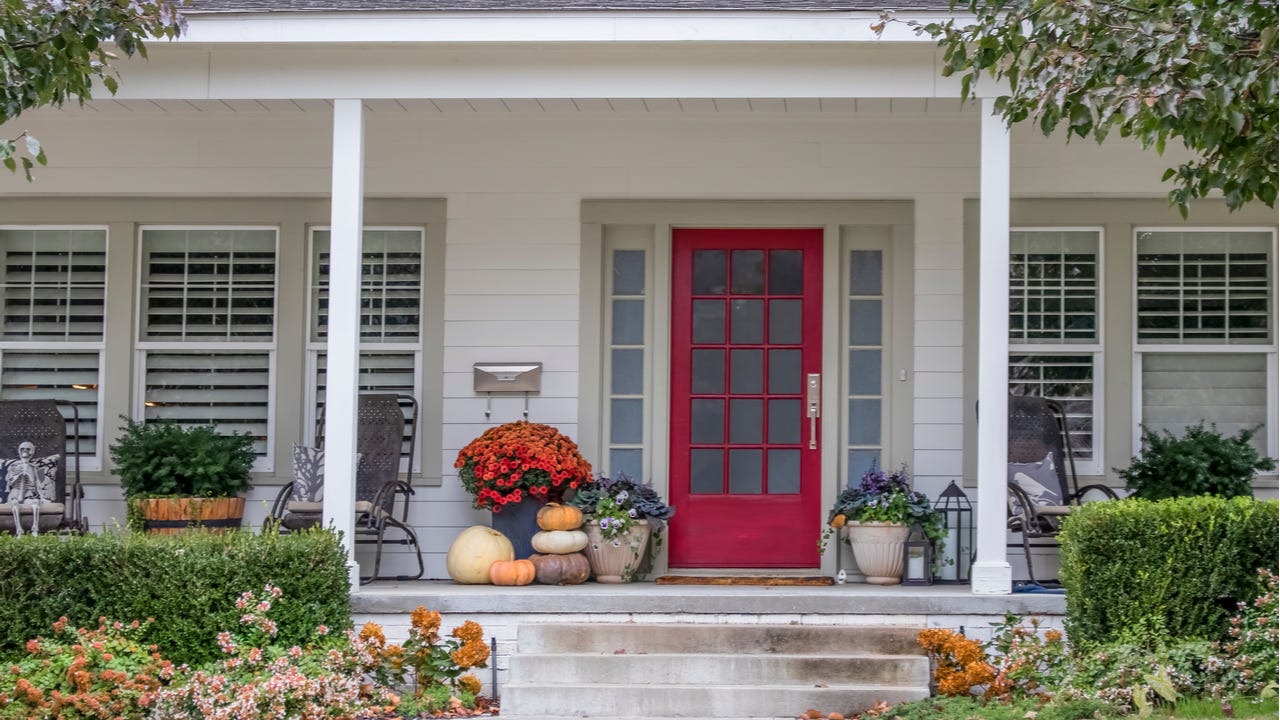 The front porch of a home with planters and curb appeal