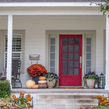 The front porch of a home with planters and curb appeal