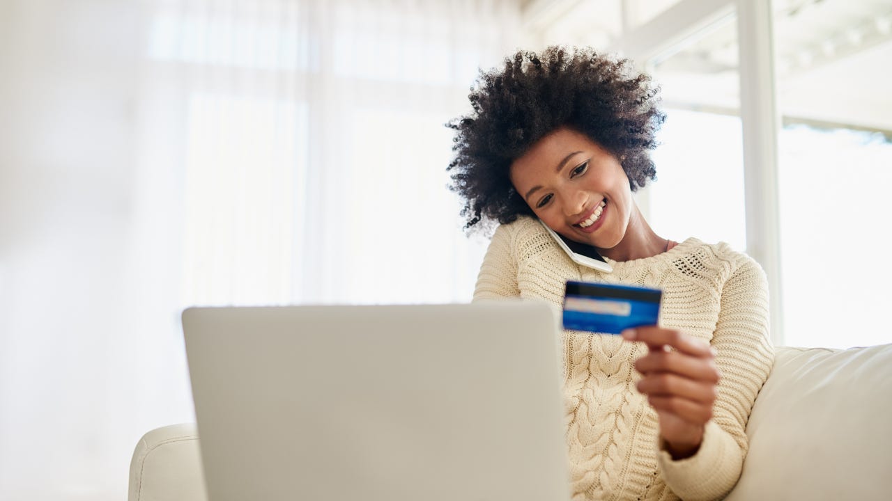 Person at computer with credit card