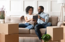 Couple looks at a tablet in a new home