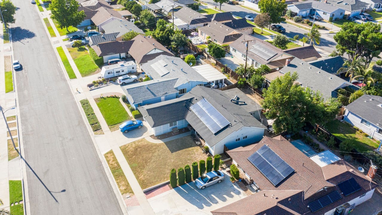 An aerial view of a neighborhood with single-family homes