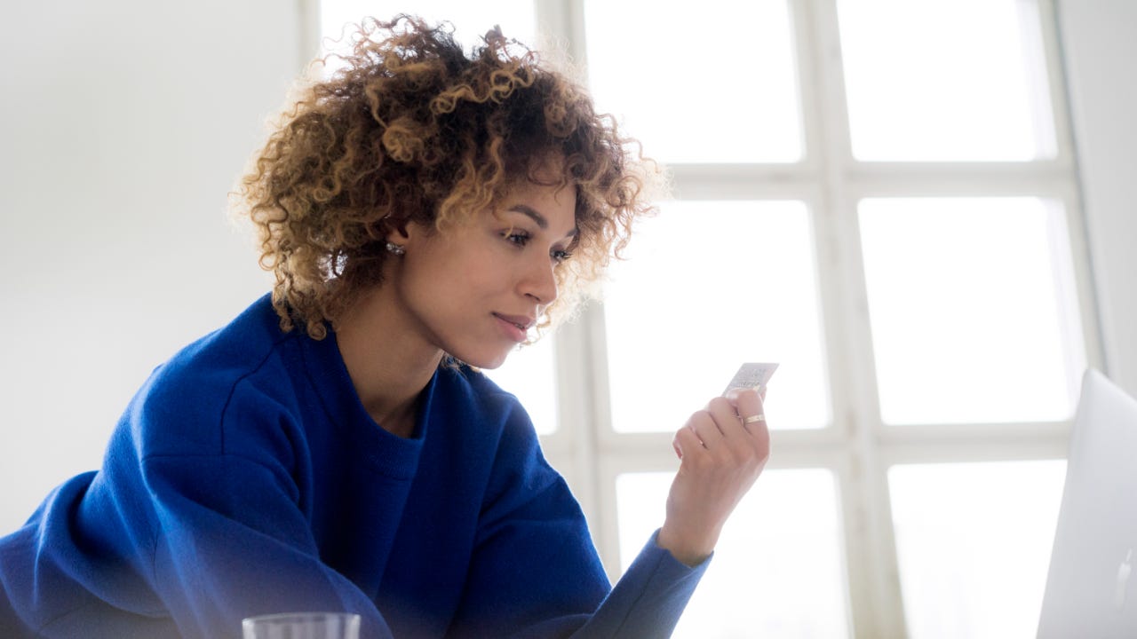 Person holding credit card