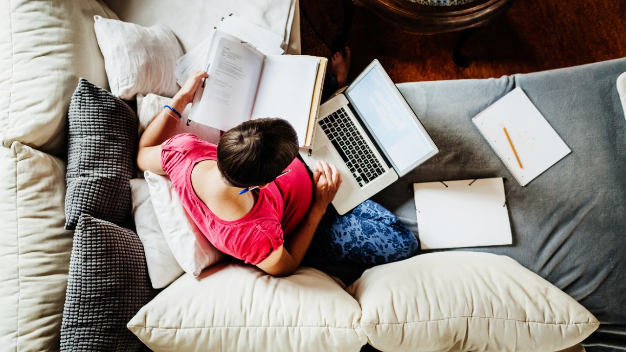 A woman looking over documents from above