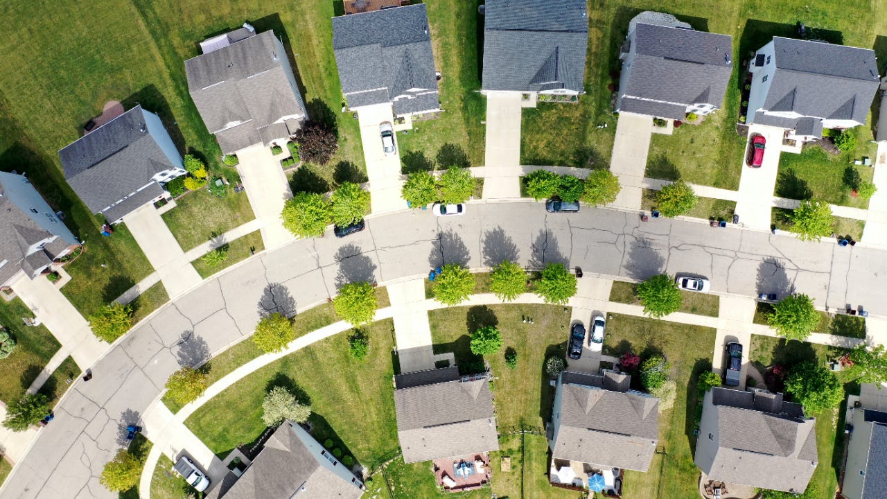 Aerial view of a subdivision and houses in a neighborhood