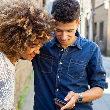 young couple looking at phone
