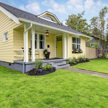 A yellow one-story single-family home