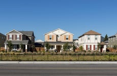 A row of single-family homes along a major thoroughfare
