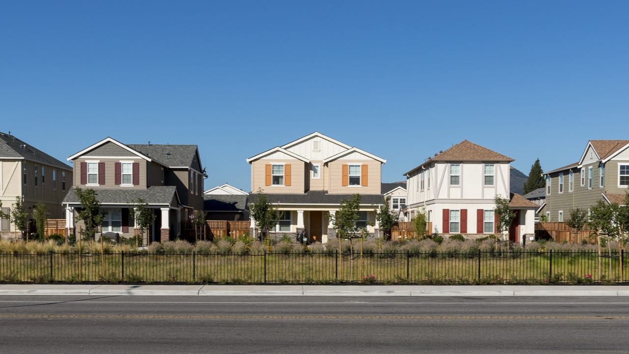 A row of single-family homes along a major thoroughfare