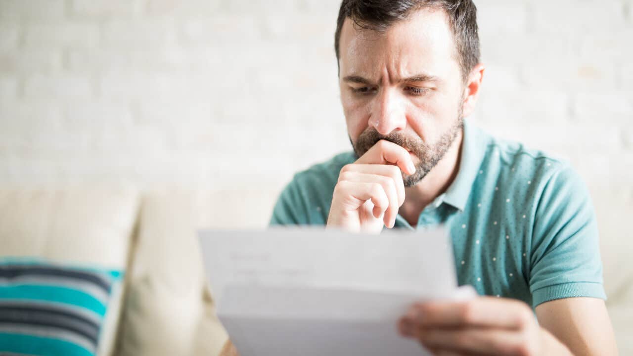 Man reading mail