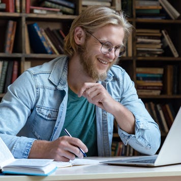 College student studies in the library