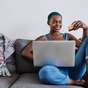 Person on computer with credit card