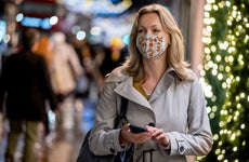Woman holiday shopping with mask on