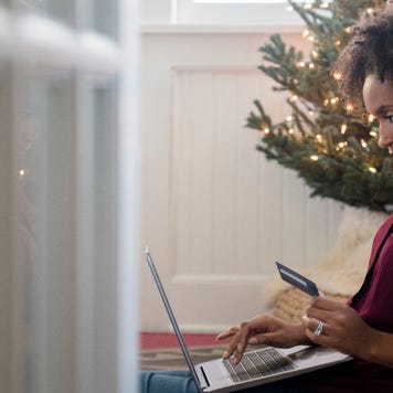 Person shopping on laptop