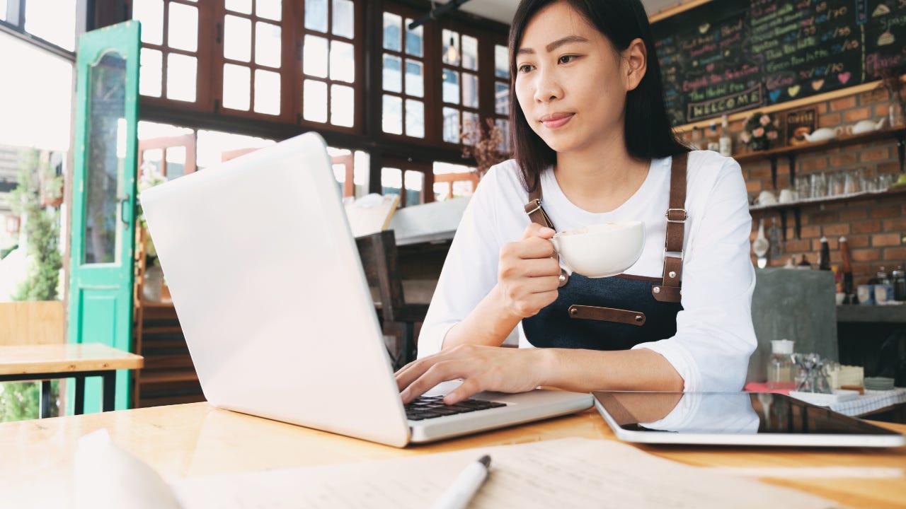 A business owner works on her laptop.