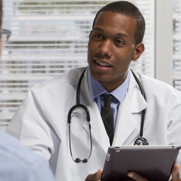 Doctor discusses treatment with patient