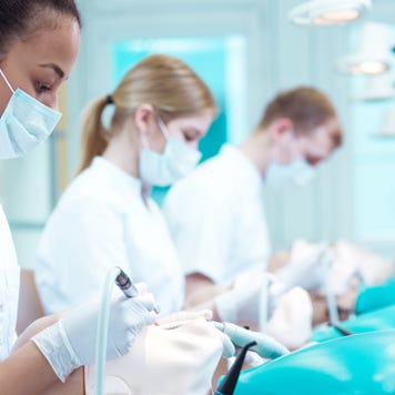Dental school students train on mannequins