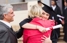 Parents embrace graduating college student