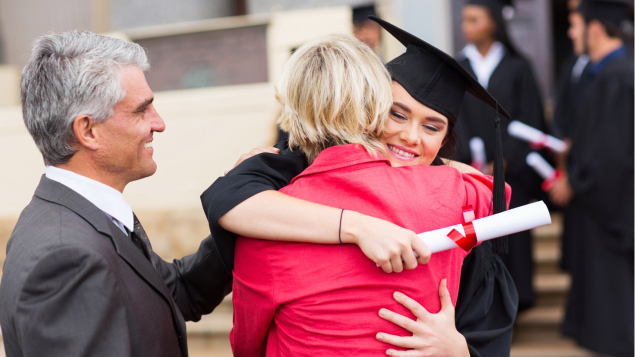 Parents embrace graduating college student