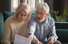 Husband and wife look over financial documents