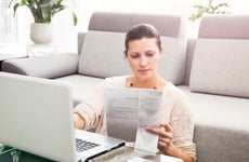 Woman in her 30s filling out tax information online
