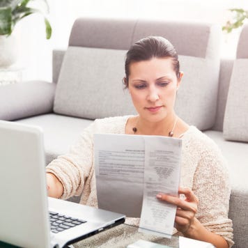 Woman in her 30s filling out tax information online