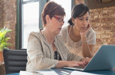 Businesswomen using laptop