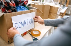 Person packing a donation box
