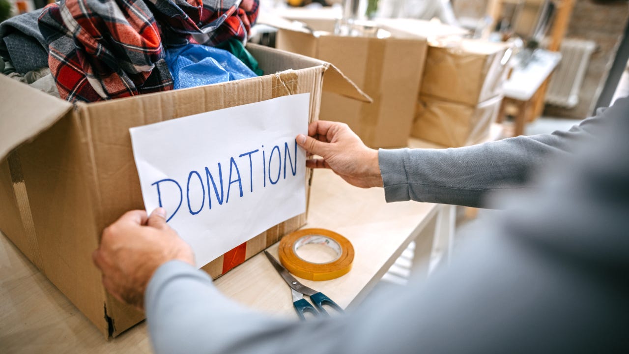 Person packing a donation box