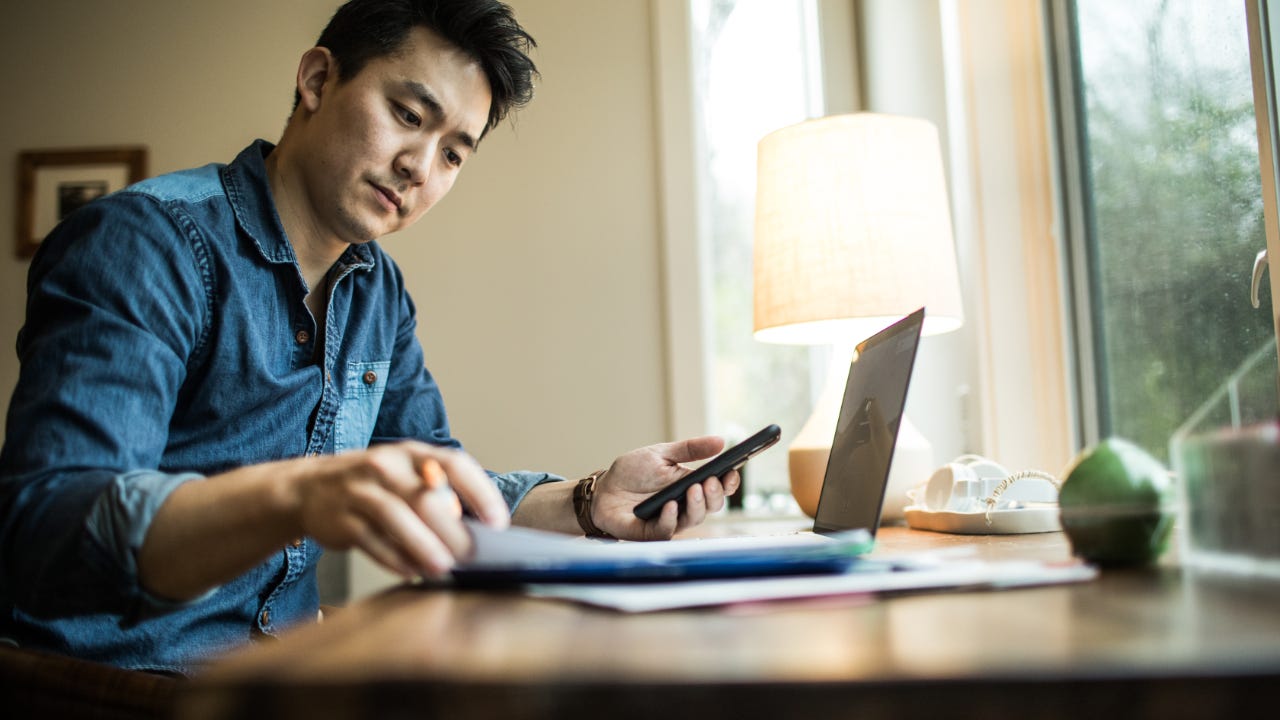 Man (early 30s) working in home office