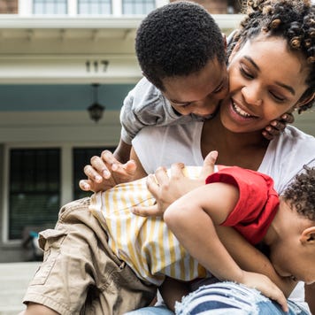 Young mother playing with her children
