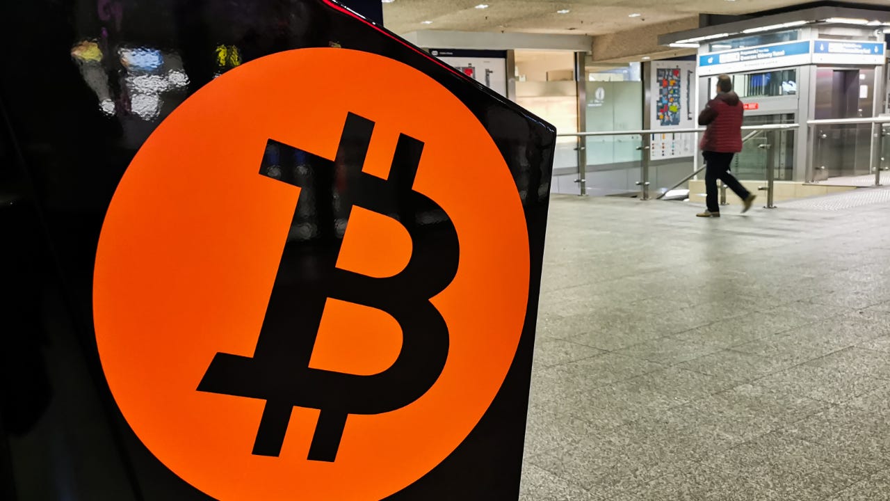 A photo of a bitcoin ATM in a train station