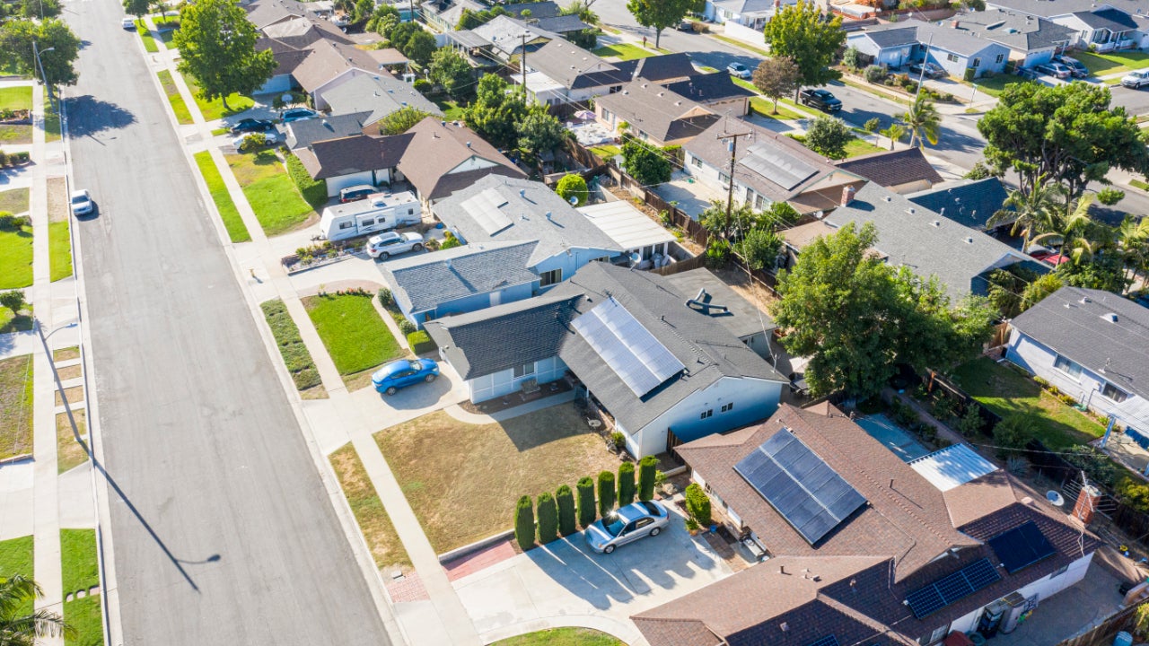 A neighborhood in southern California where many homes have solar panels installed