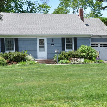 A one-story single-family home and yard