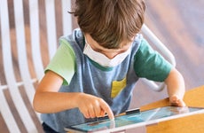kid playing with tablet