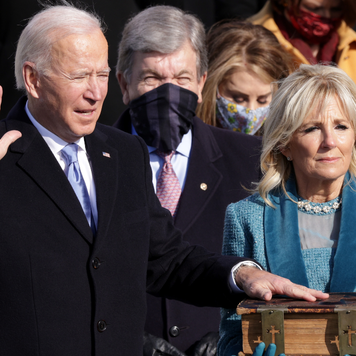 Joe Biden is sworn in as U.S. President as his wife Dr. Jill Biden stands beside him.