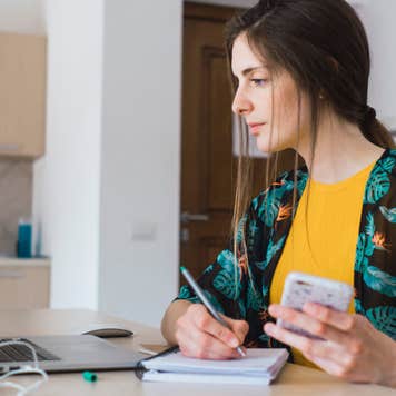 Woman paying bills online