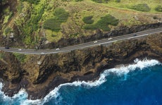 Winding coastal road on Hawaii coastline.