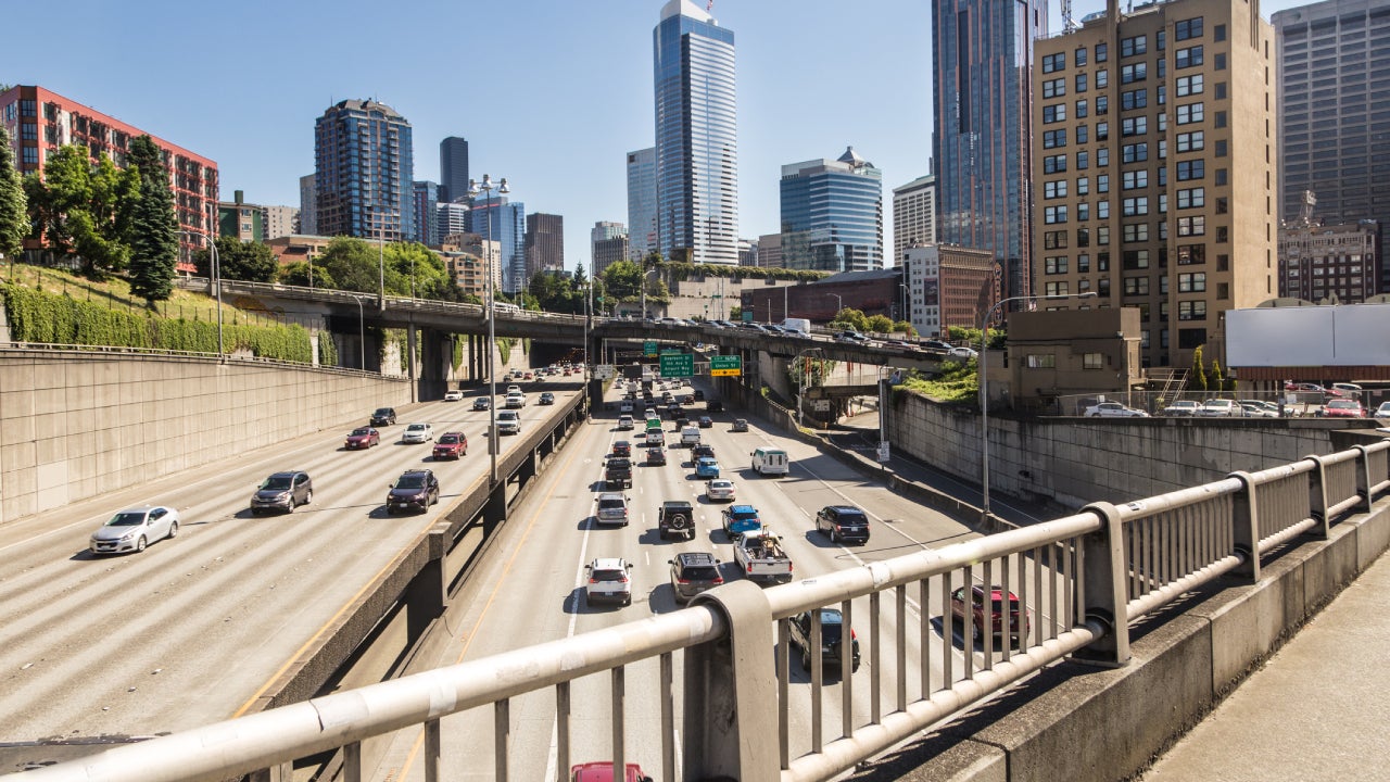 View of Seattle highway from the railing of an overpass.