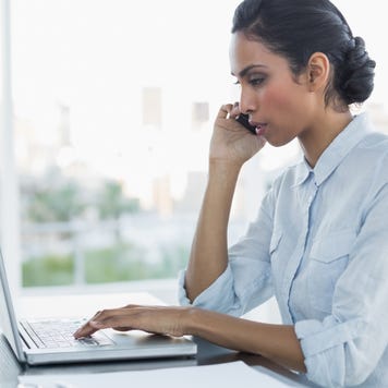 Woman in office on phone