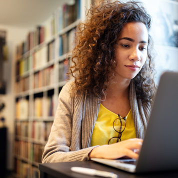 Student works in college library