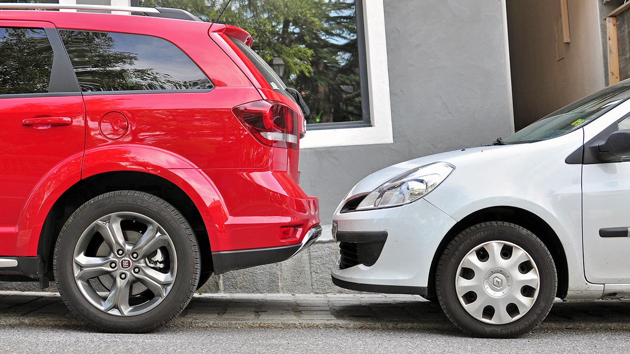 SAINT GERVAIS, FRANCE - AUGUST 13: Two cars parked in the street of Saint Gervais on August 13, 2015. Saint Gervais is a commune in the Haute-Savoie, France.