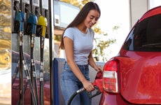 Woman pumping gas