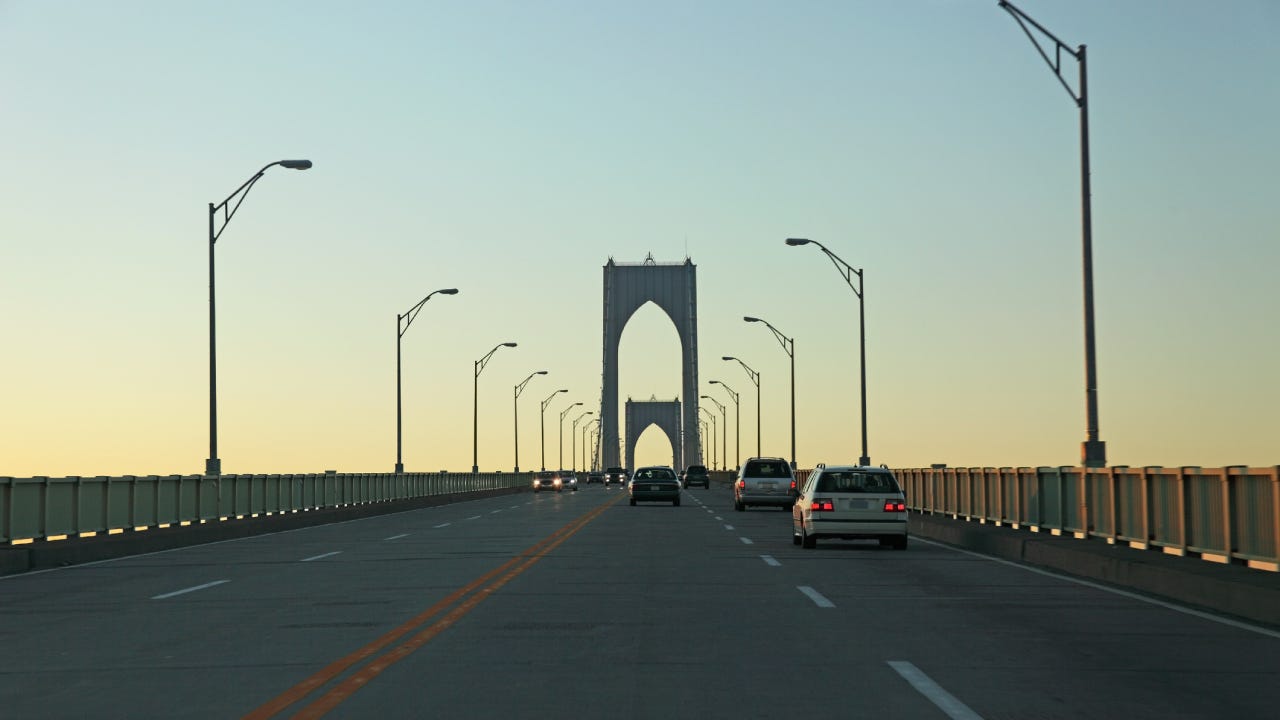 Shot of the road on the Newport Bridge at sunset.